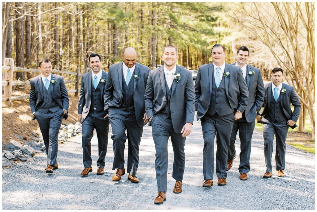 The groom and groomsmen walking together.
