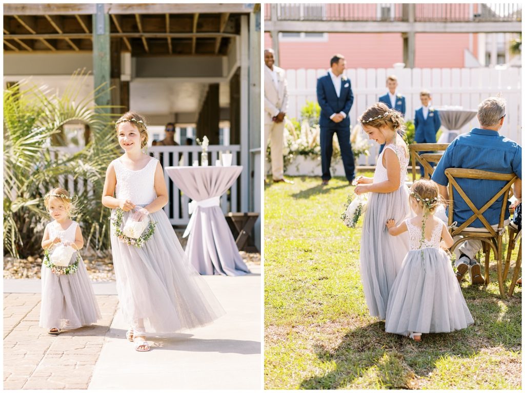 Flower Girls with flower rings and flower  crowns walking down the aisle in steel grey.