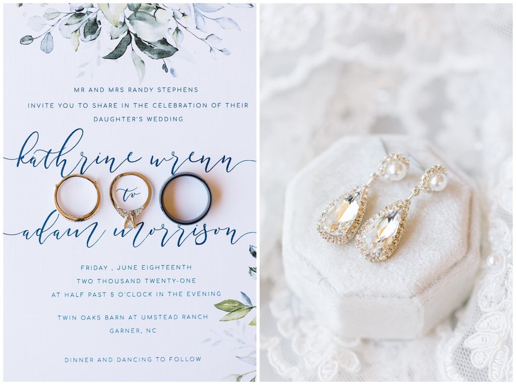 The wedding bands lay on top of their navy invitation next to her earrings on a white velvet box.
