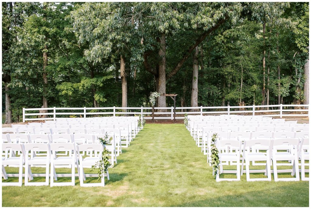Ceremony decorations and florals on the arbor for this outdoor farm ceremony at Twin Oaks Barn.