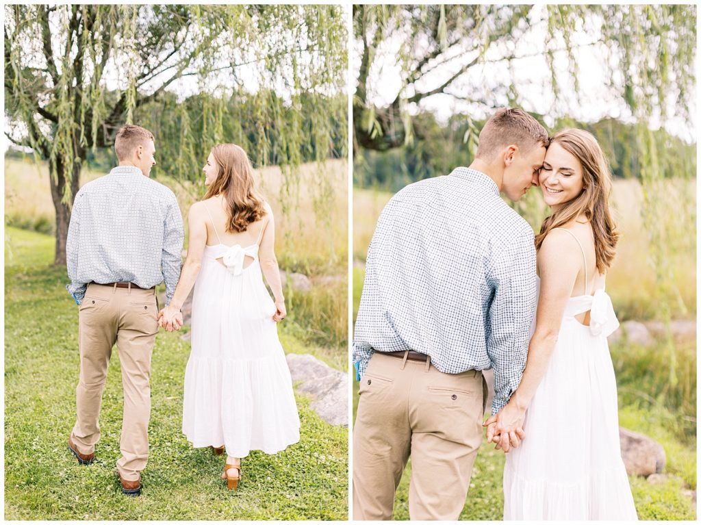 The couple walks away from the camera holding hands.