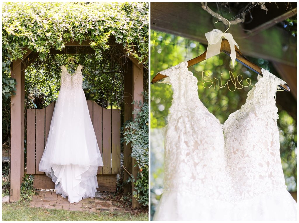 The bride's wedding dress hanging on an arbor in the church garden.