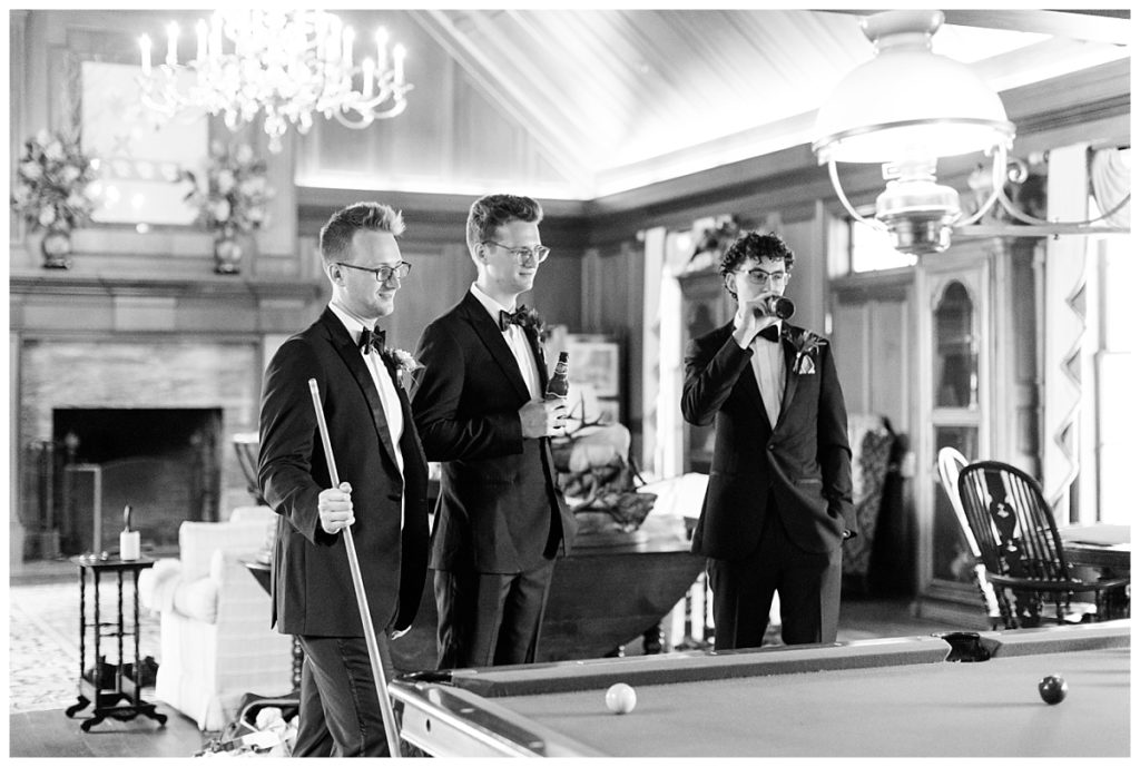 The groomsmen played pool together before the wedding day.
