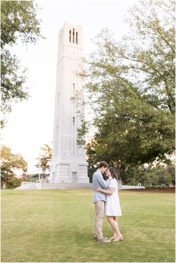 Couples engagement photos at the Bell Tower at NC State in Raleigh.