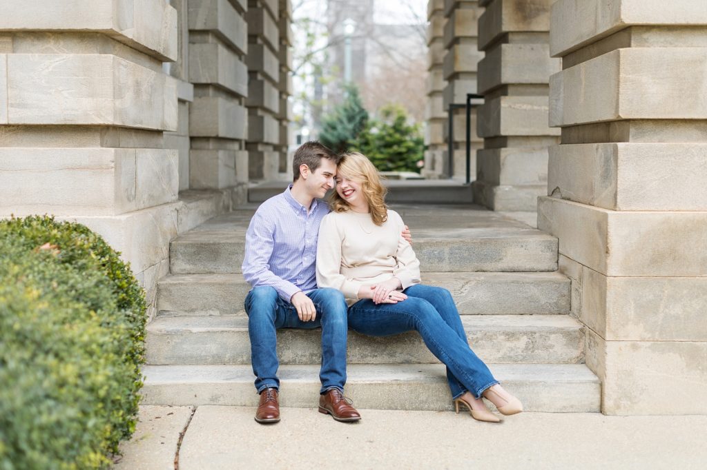 Engagement photo sitting on the steps of the Capitol Building in Raleigh.