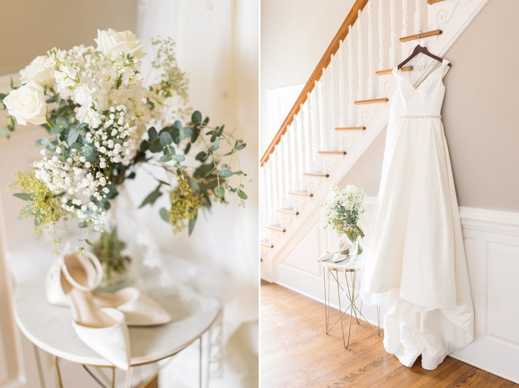 A satin wedding gown hanging on the wedding day with a bridal bouquet and shoes next to it | Raleigh Wedding Photographer