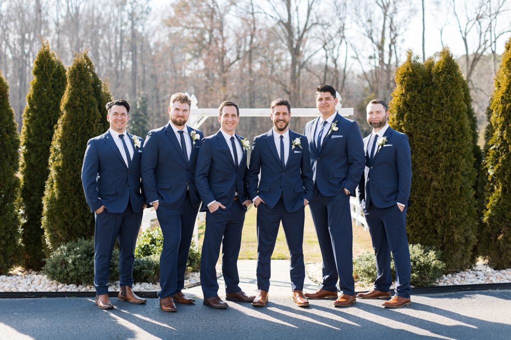 The groom and his groomsmen wore navy blue suits | Raleigh Wedding Photographer