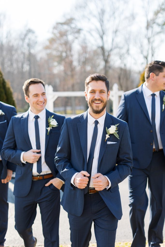The groom smiling with his brother on his wedding day | Raleigh Wedding Photographer