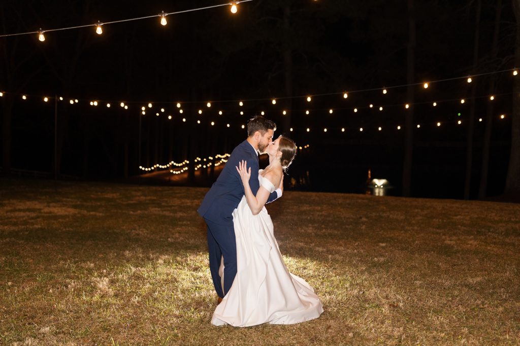 The bride and groom at night under a sky of string lights | Raleigh Wedding Photographer