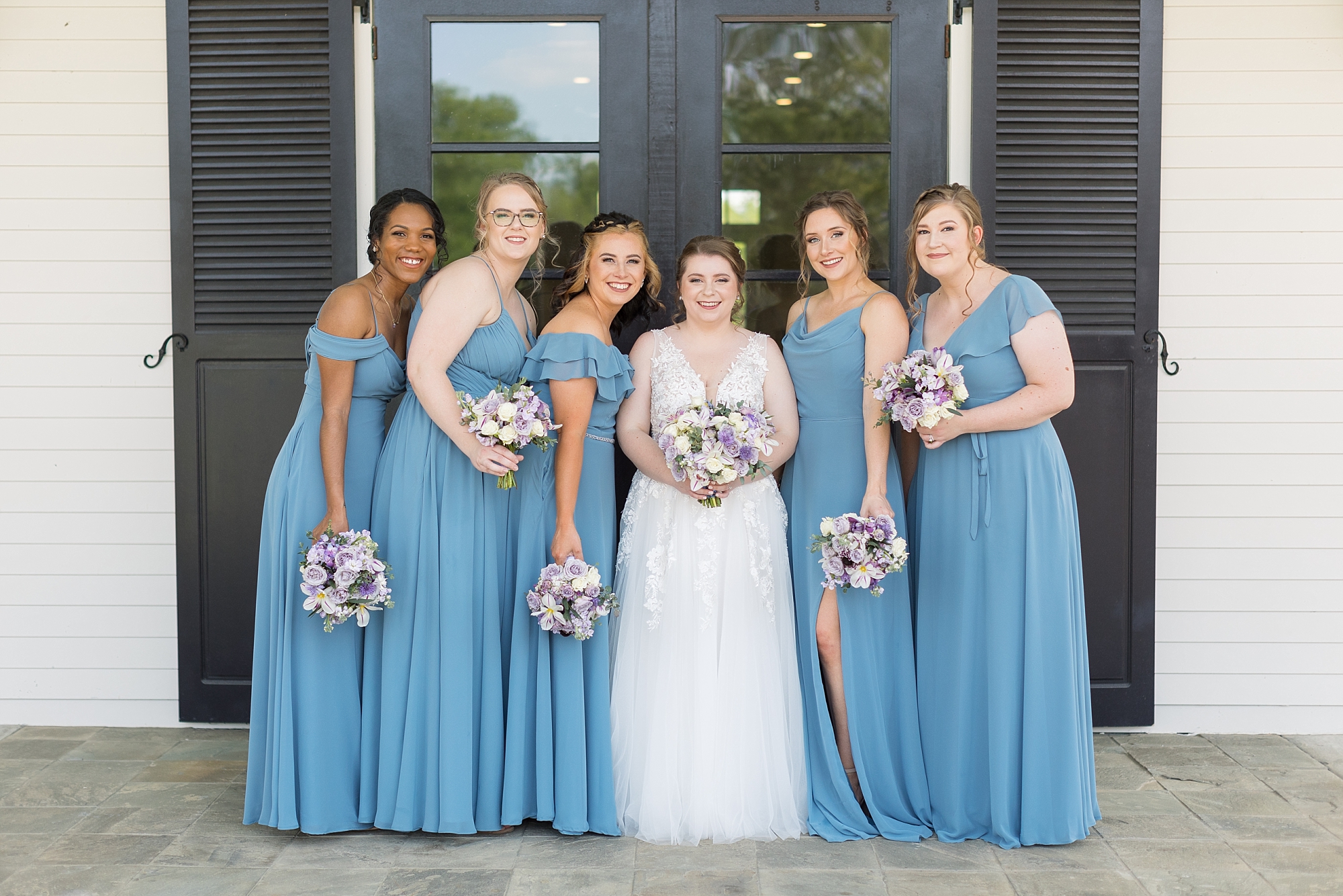 Bride with her bridal party in blue dresses - Raleigh NC Wedding Photographer - Sarah Hinckley Photography