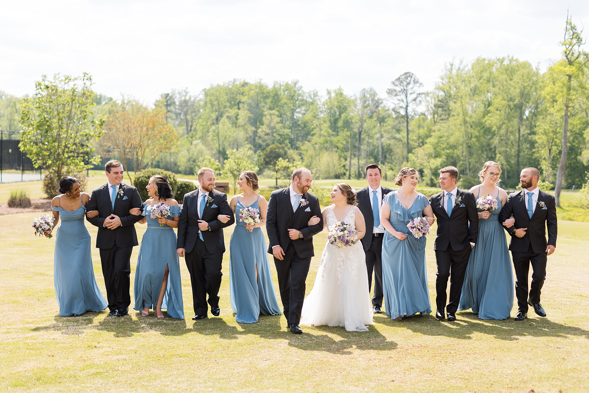 wedding party walking arm in arm - Raleigh NC Wedding Photographer - Sarah Hinckley Photography