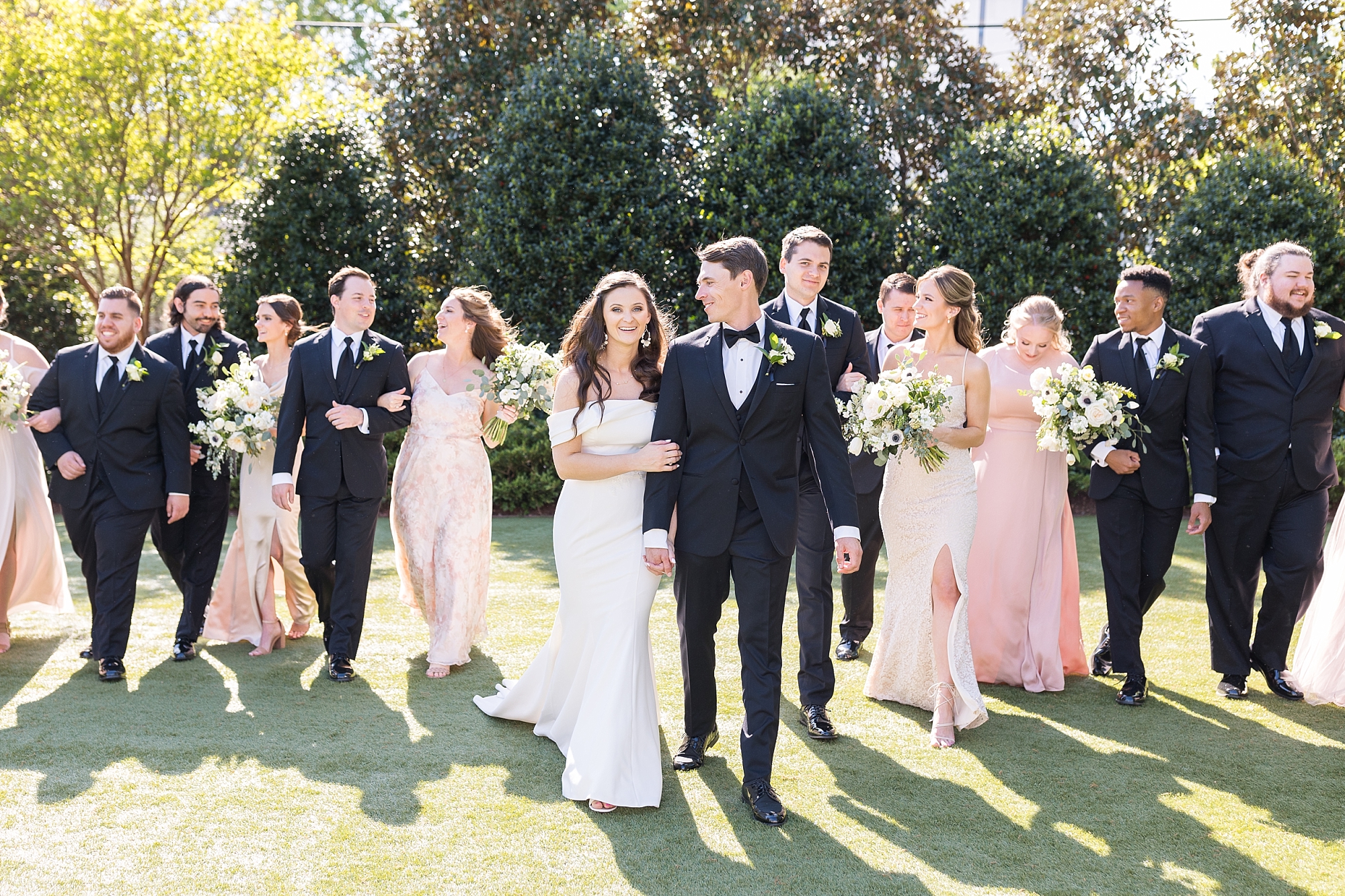The bridal party walking together on the lawn  | Merrimon Wynne Wedding | Sarah Hinckley Photography | Raleigh NC Wedding Photographer