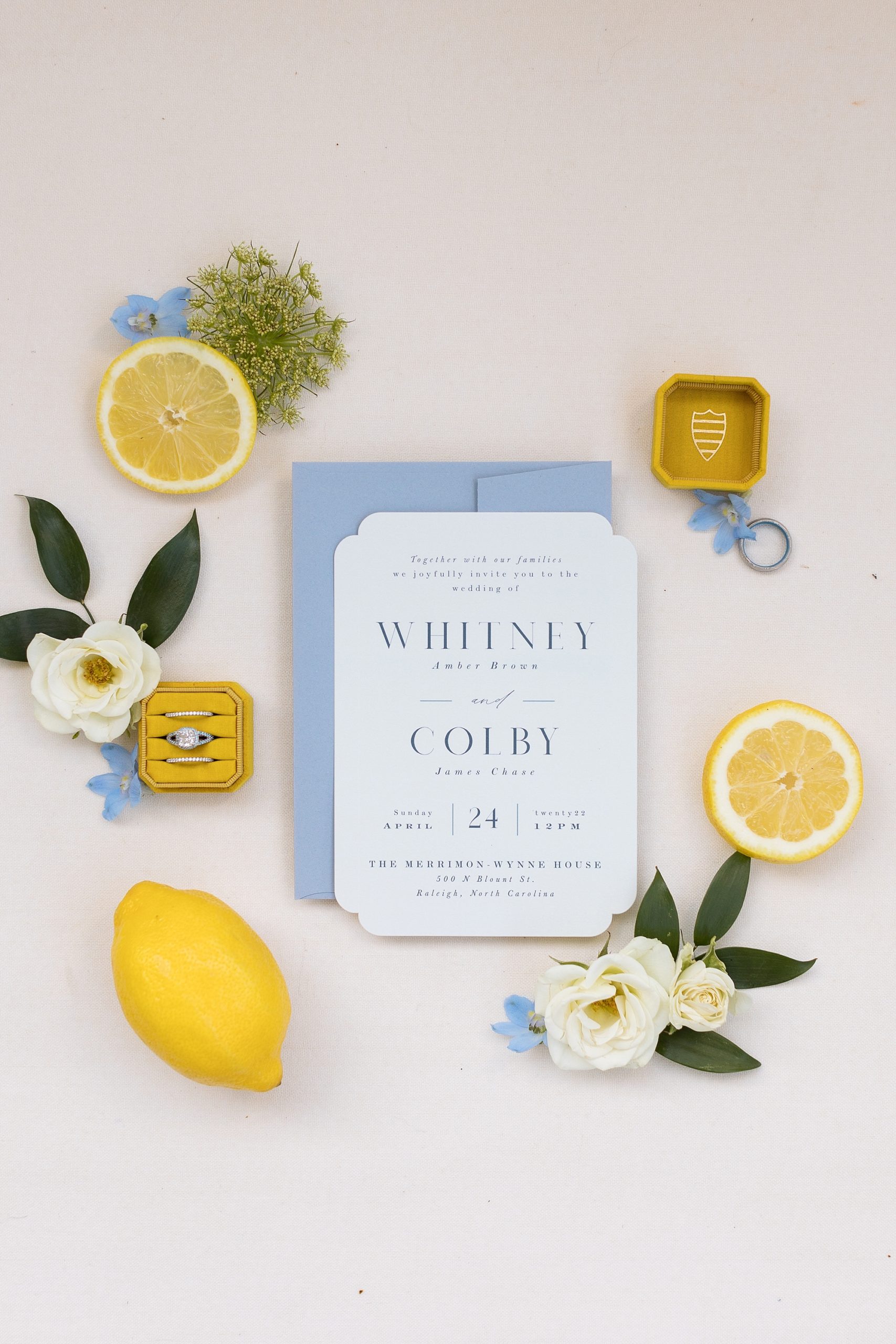 Photo of wedding details with lemons and blue invitation | Raleigh NC Wedding Photographer