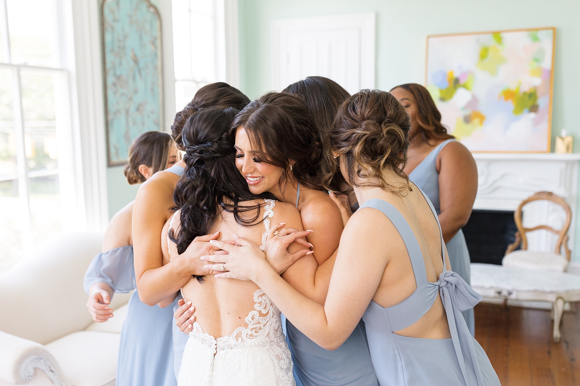 Bridesmaids hugging bride | Raleigh NC Wedding Photographer