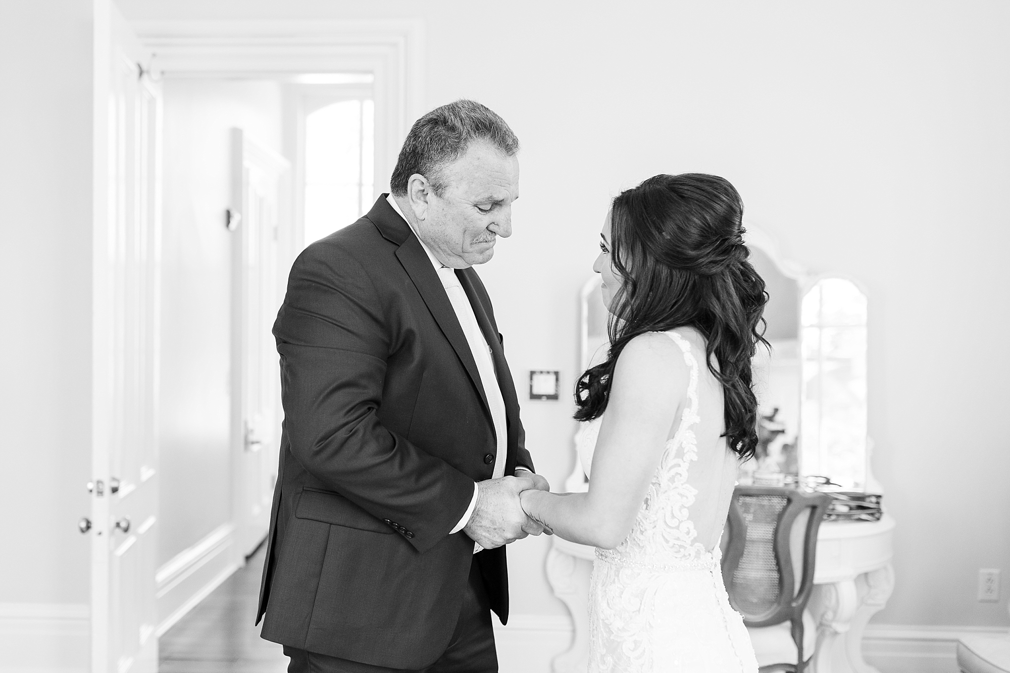 Step-dad praying over the bride before walking down the aisle | Raleigh NC Wedding Photographer