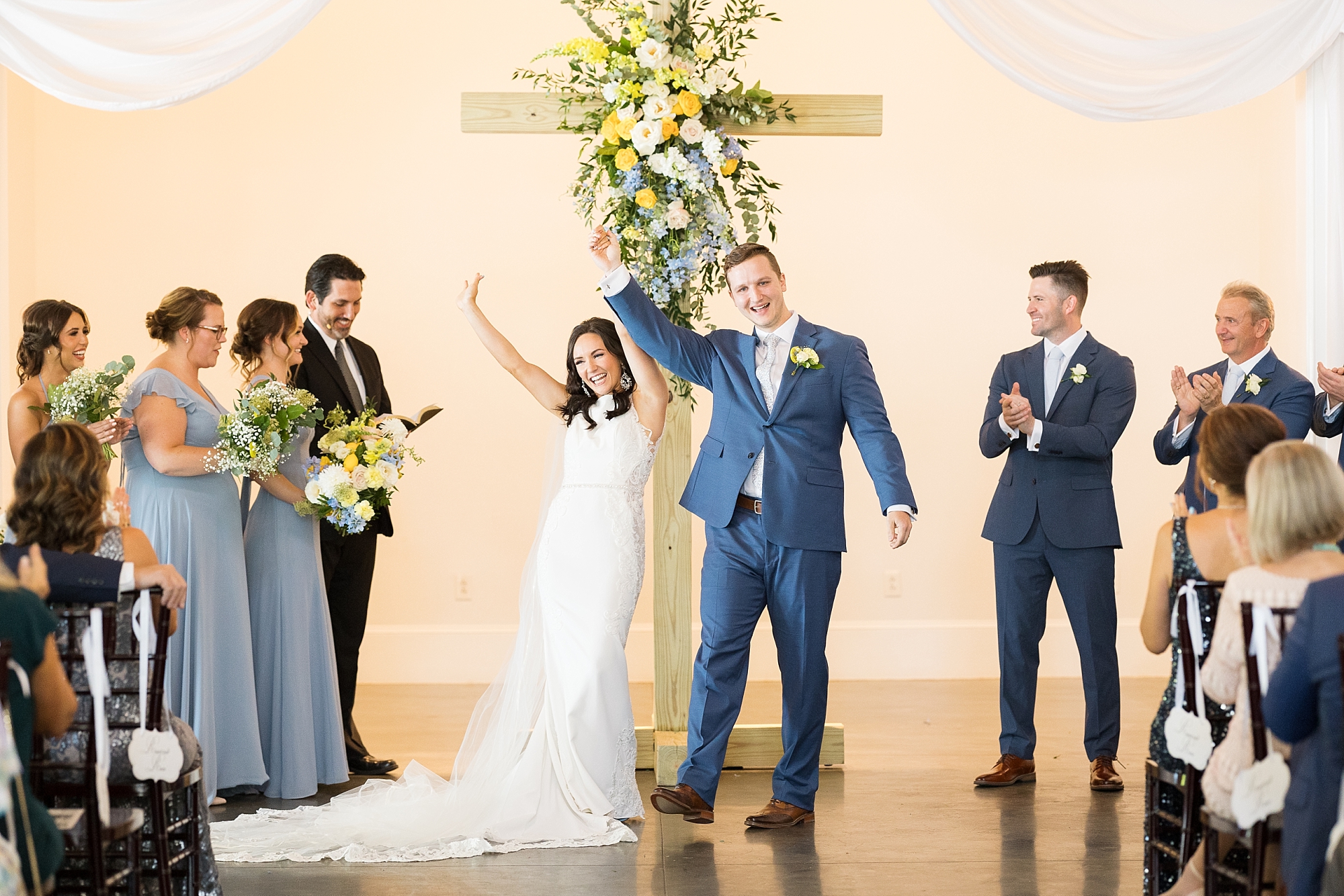 Bride and groom walking down the aisle | Raleigh NC Wedding Photographer