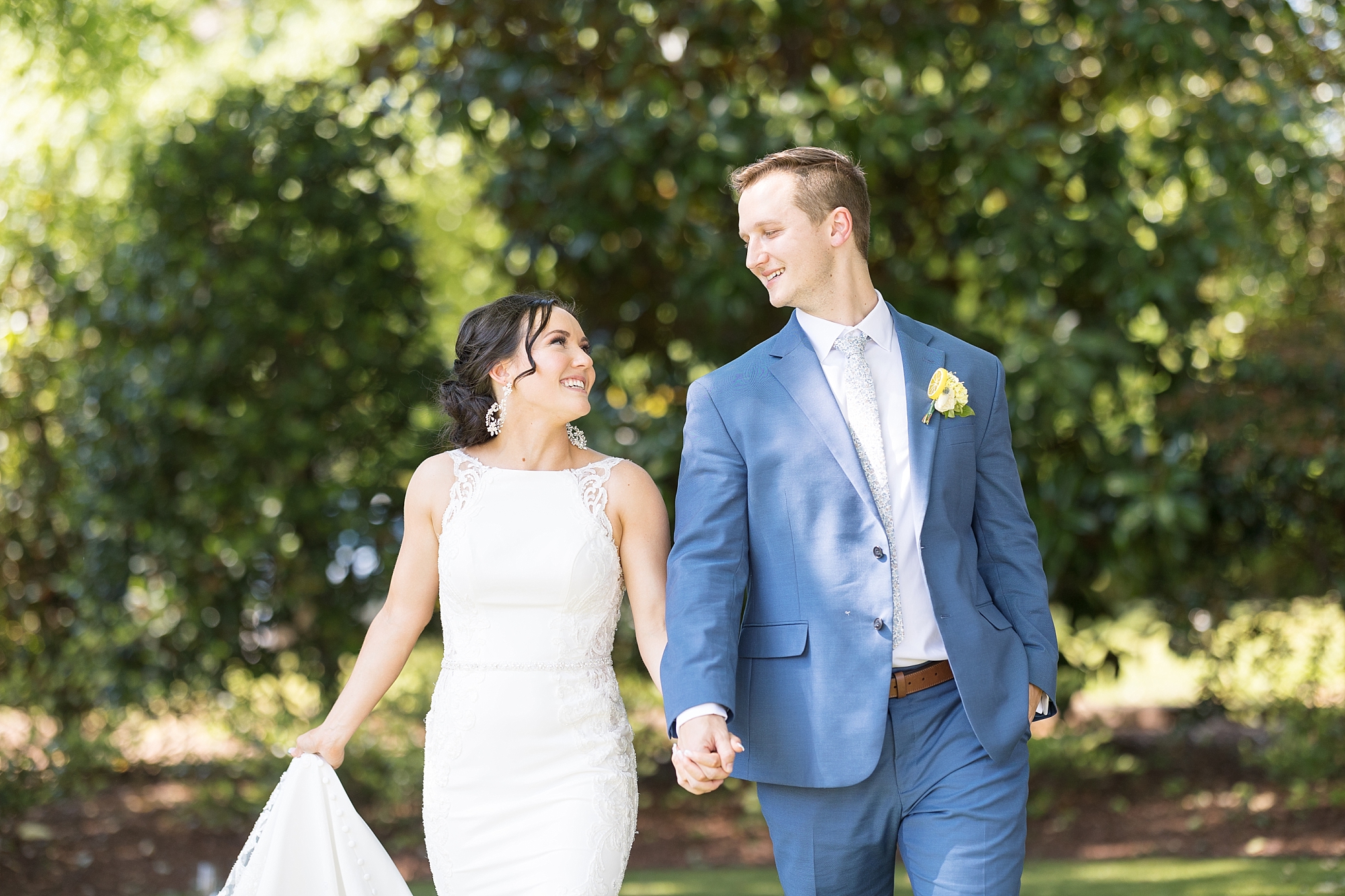 Bride and groom holding hands | Raleigh NC Wedding Photographer