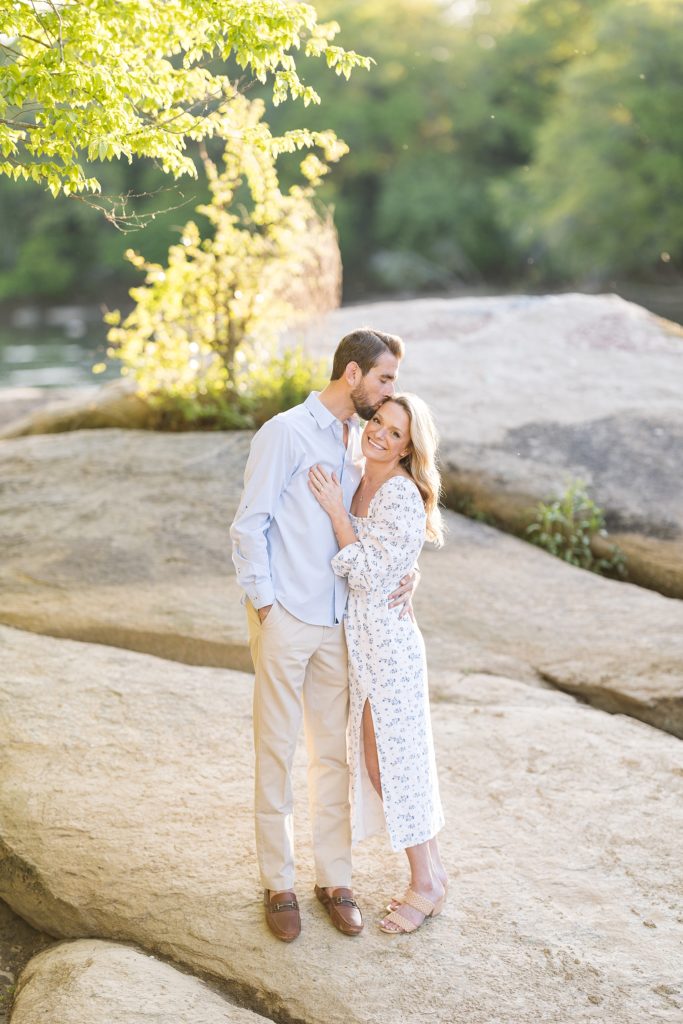 Kissing of the forehead during engagement photos  | Raleigh NC Wedding Photographer