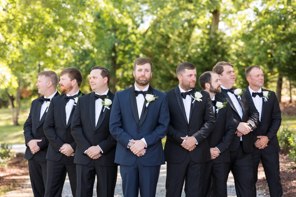Groom in blue and groomsmen in black  | Raleigh NC Wedding photographer