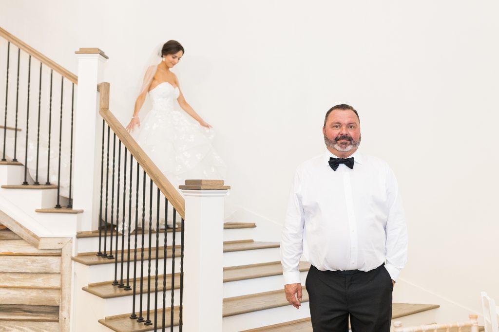 bride walking down stairs at Southern Grace Farms | Raleigh NC Wedding photographer