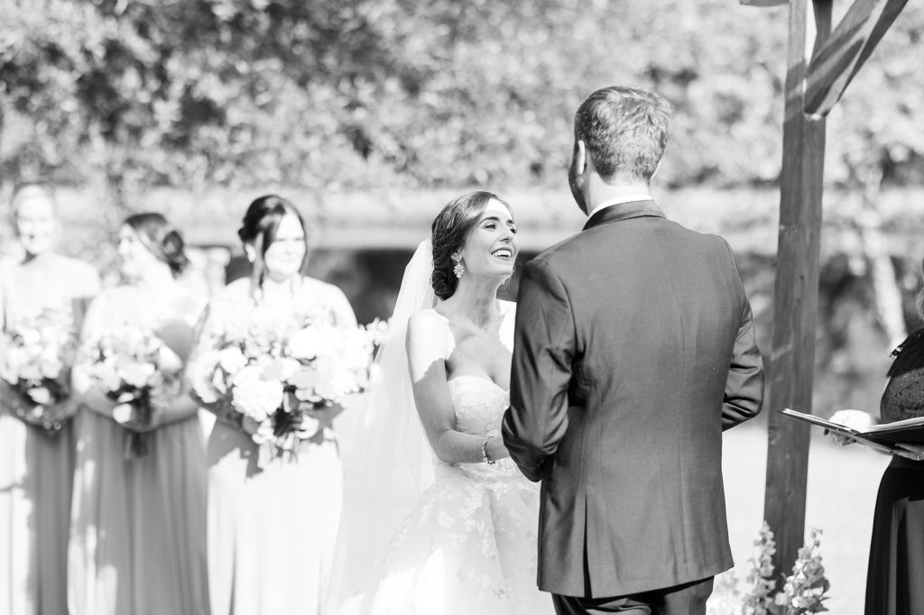 black and white photo of bride and groom during wedding ceremony  | Raleigh NC Wedding photographer