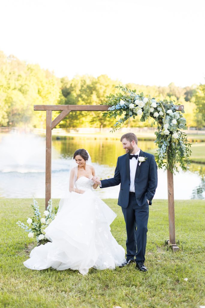 bride and groom with water in the background | Raleigh NC Wedding photographer