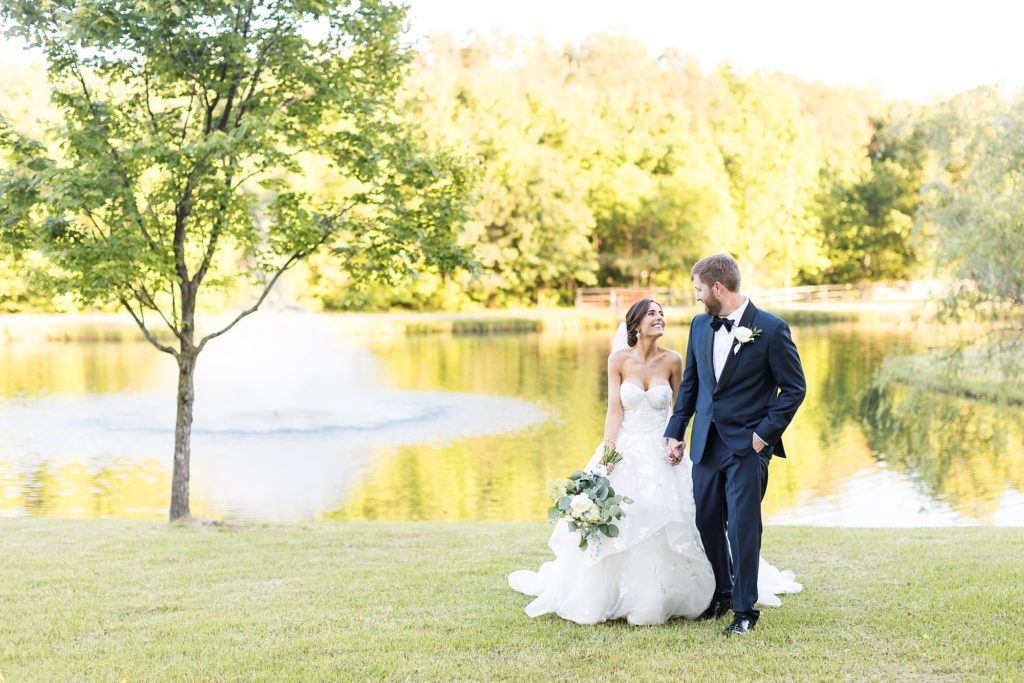 bride and groom near pond | Raleigh NC Wedding photographer