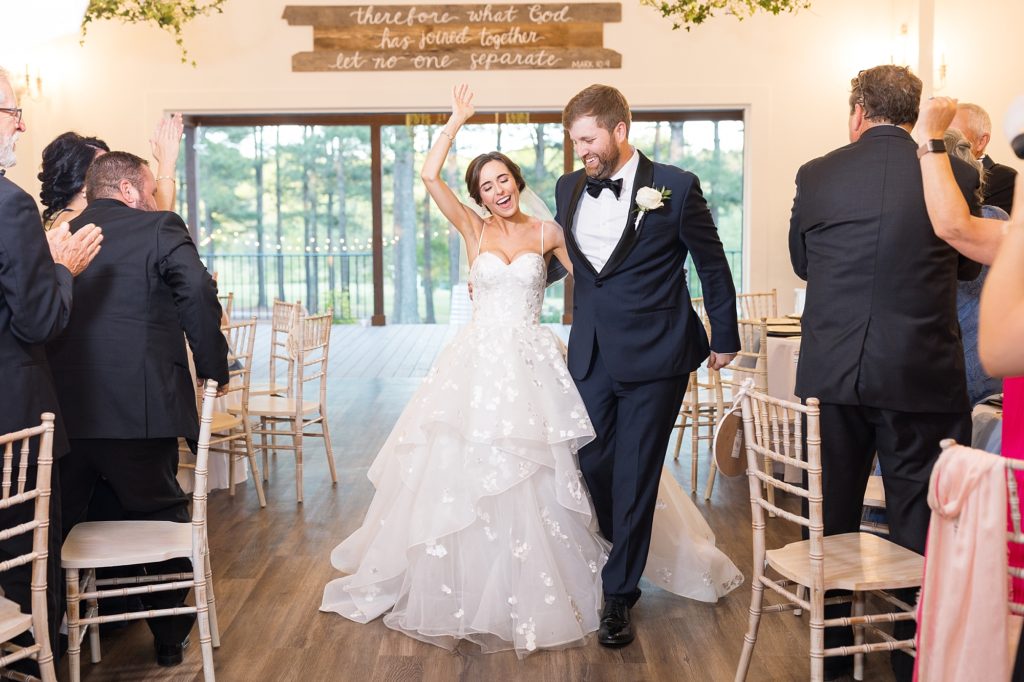 Bride and groom entering reception | Raleigh NC Wedding photographer