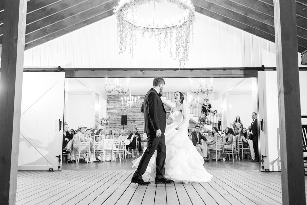 Bride laughing during first dance | Raleigh NC Wedding photographer