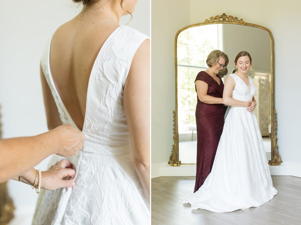 The bride getting ready with her mom in the bridal suite with a gold antique mirror  | Carolina Grove | Raleigh NC Wedding Photographer | Sarah Hinckley Photography