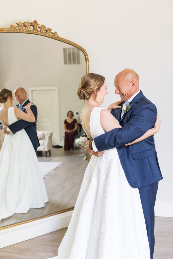 The father of the bride hugs his daughter on his wedding day  | Carolina Grove | Raleigh NC Wedding Photographer | Sarah Hinckley Photography
