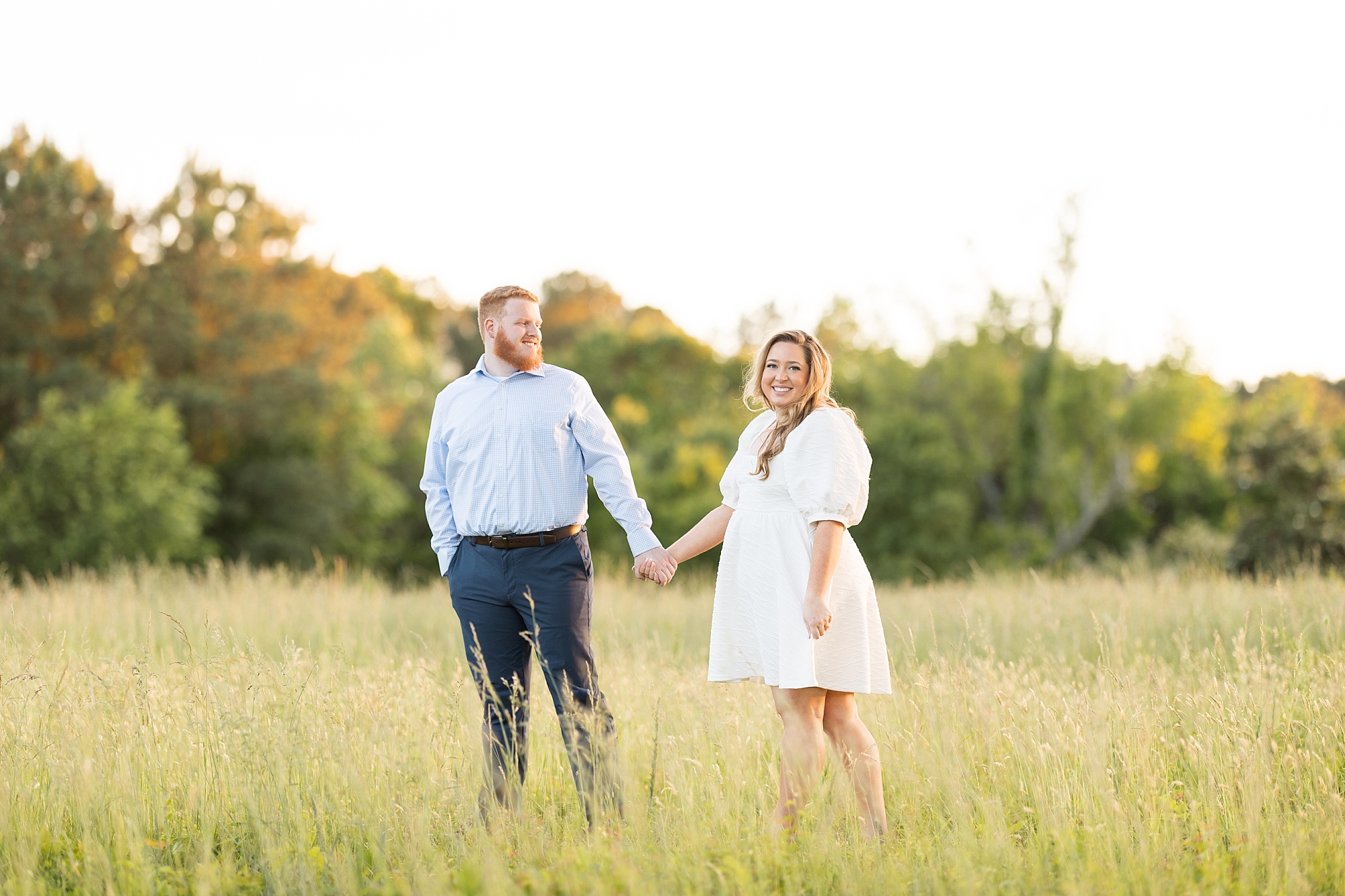 Free people white dress in a field for engagement photos | Raleigh NC Engagement Photographer
