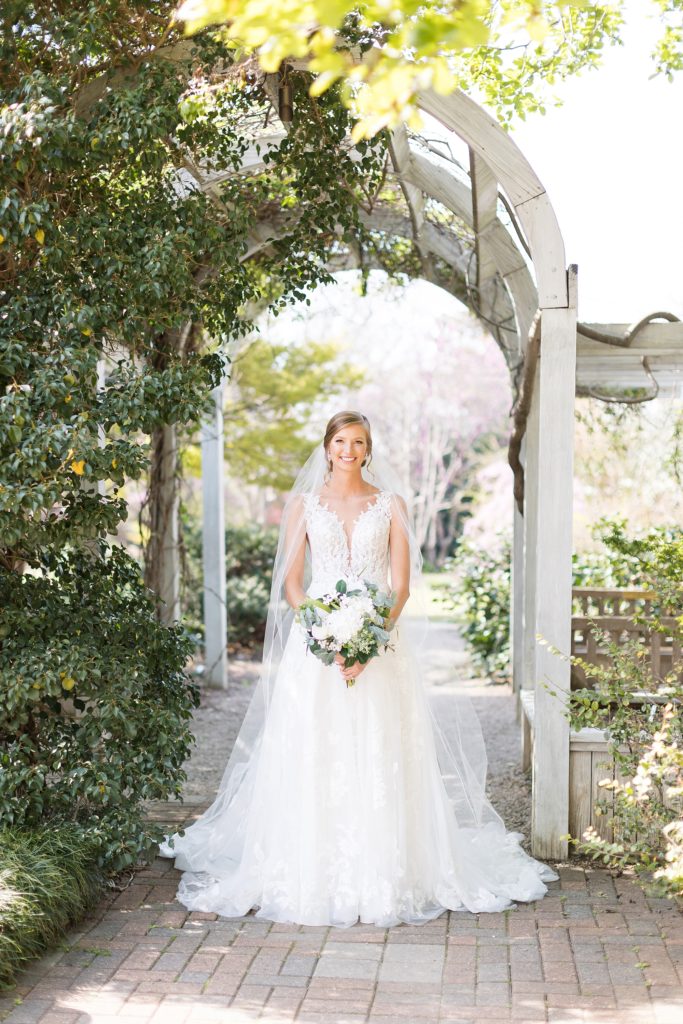 Bride under garden arch for Bridal portraits at JC Raulston Arboretum | Raleigh wedding & bridal portrait photography