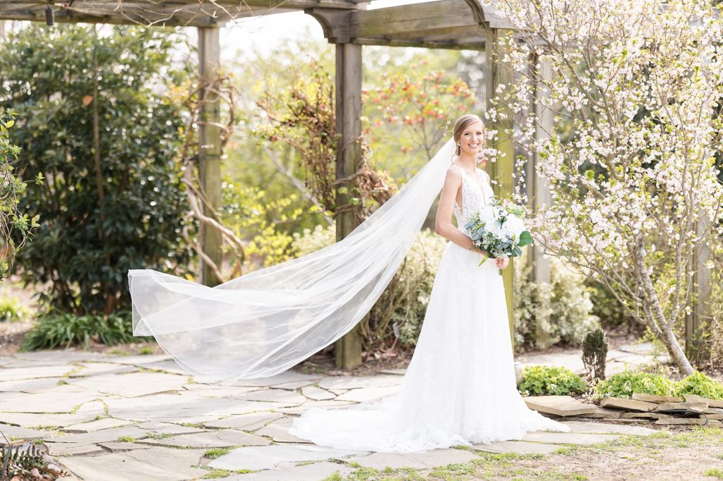 brides veil blowing during bridal portraits at JC Raulston Arboretum | Raleigh wedding & bridal portrait photography