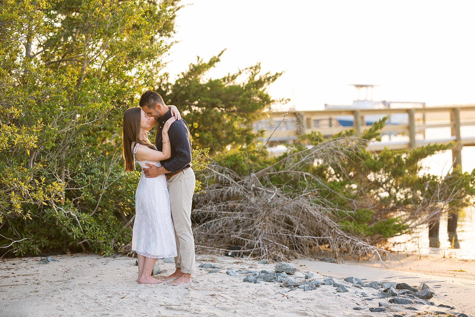 Engagement photos on the sound at Topsail Beach with boat docks | Raleigh North Carolina Wedding Photographer