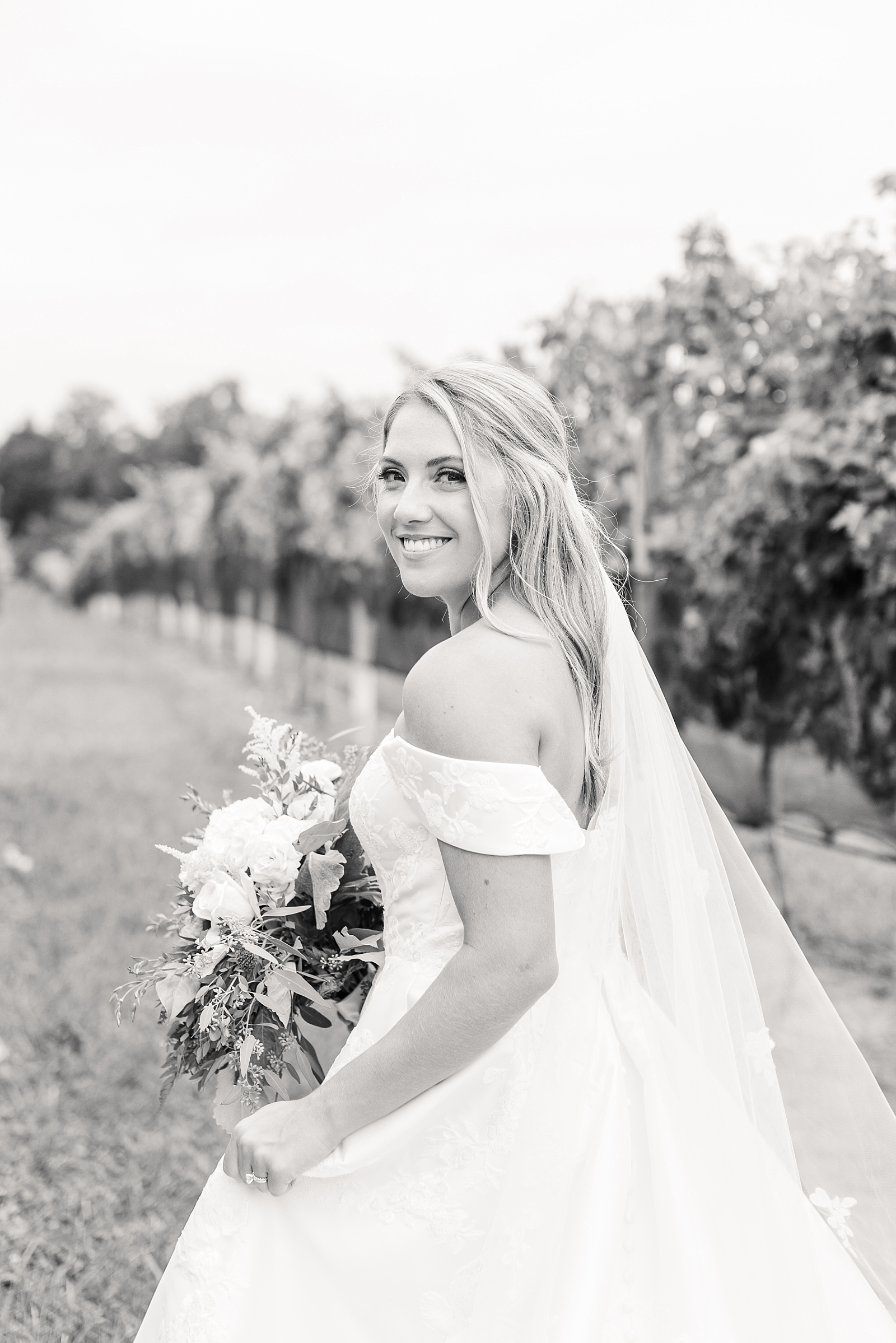 bride looking over shoulder Childress Vineyards   | NC Wedding Photographer | VA wedding photographer | Vineyard Weddings