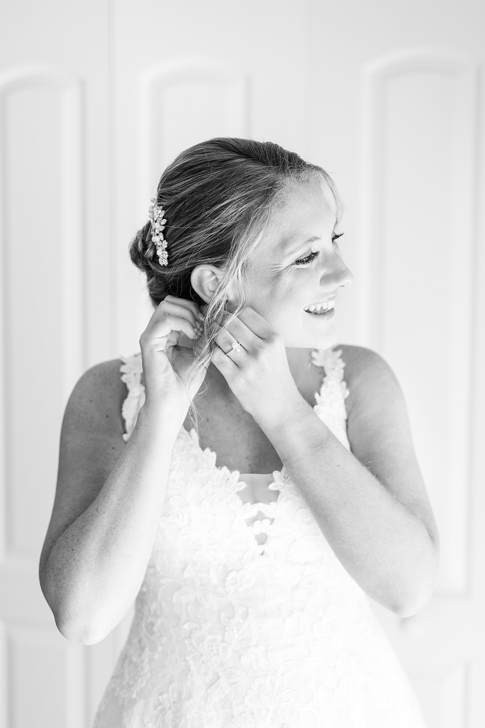 Bride putting on earrings | Raleigh Wedding Photographer Sarah Hinckley