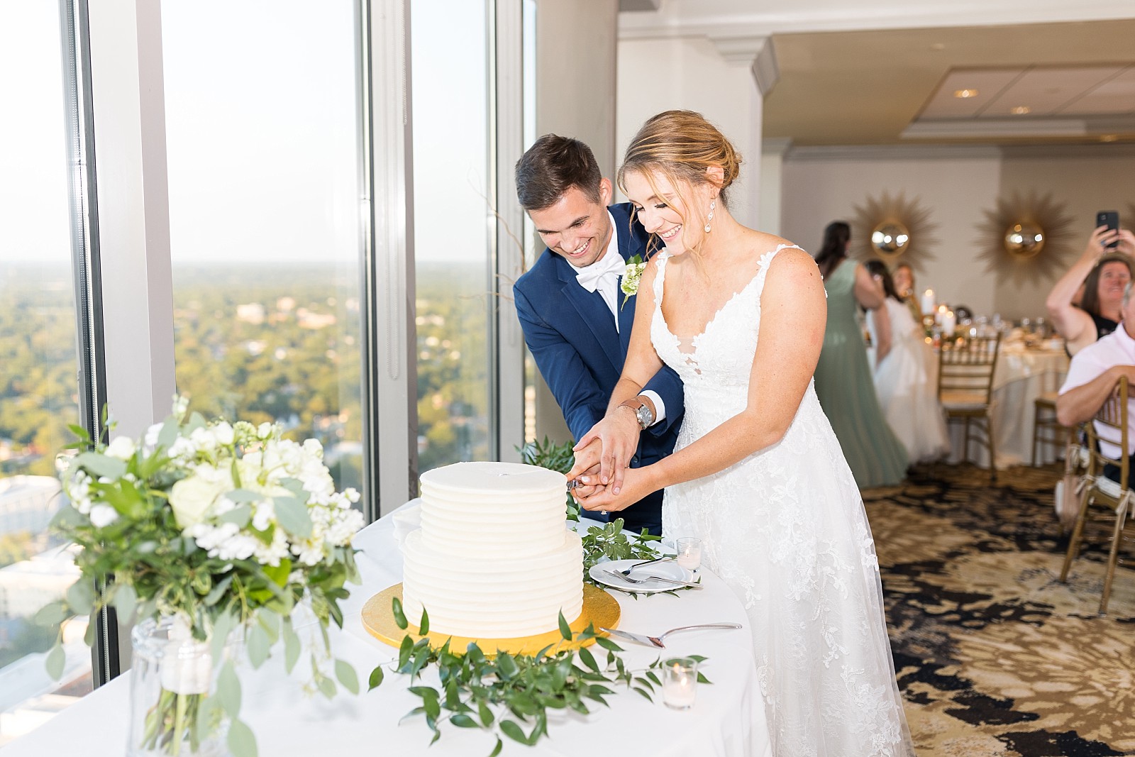 Bride and groom cutting cake | Raleigh Wedding Photographer Sarah Hinckley