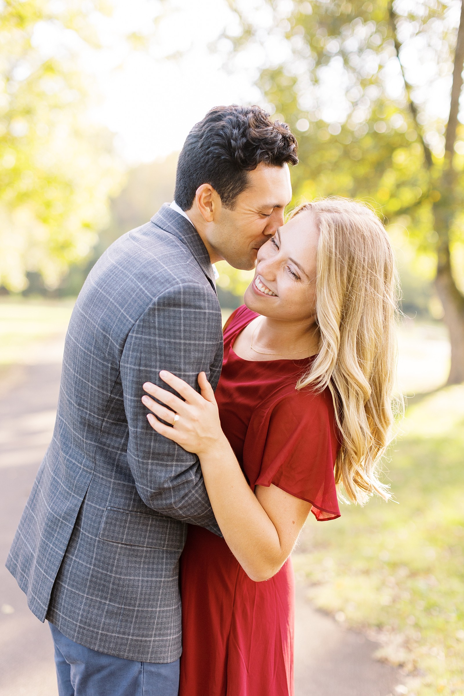 College sweethearts during Joyner Park fall engagement session | Raleigh NC wedding photographer