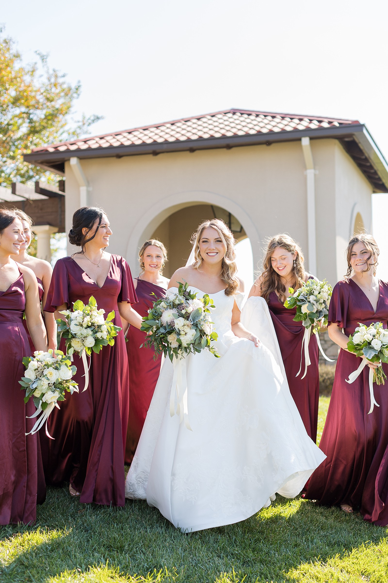Bride smiling her her bridesmaids | Childress Vineyards Wedding | winery wedding | NC Wedding Photographer 