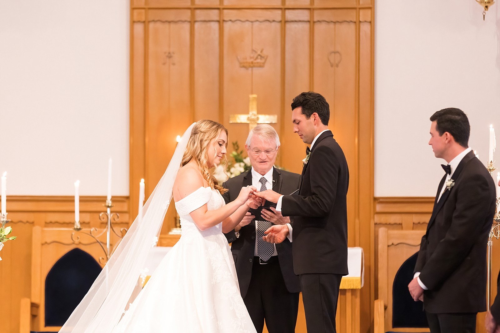 bride and groom exchanging rings | Childress Vineyards Wedding | elegant | NC Wedding Photographer 