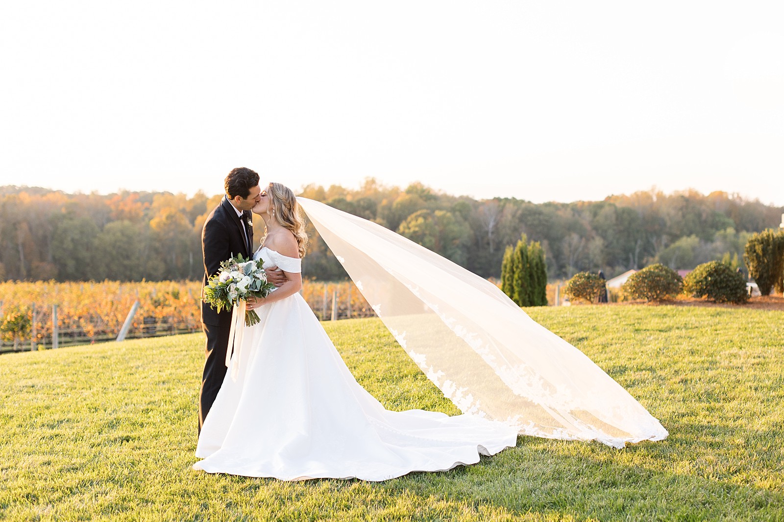 veil blowing in the wind during golden hour | Childress Vineyards Wedding | winery wedding | charlottesville | NC Wedding Photographer 