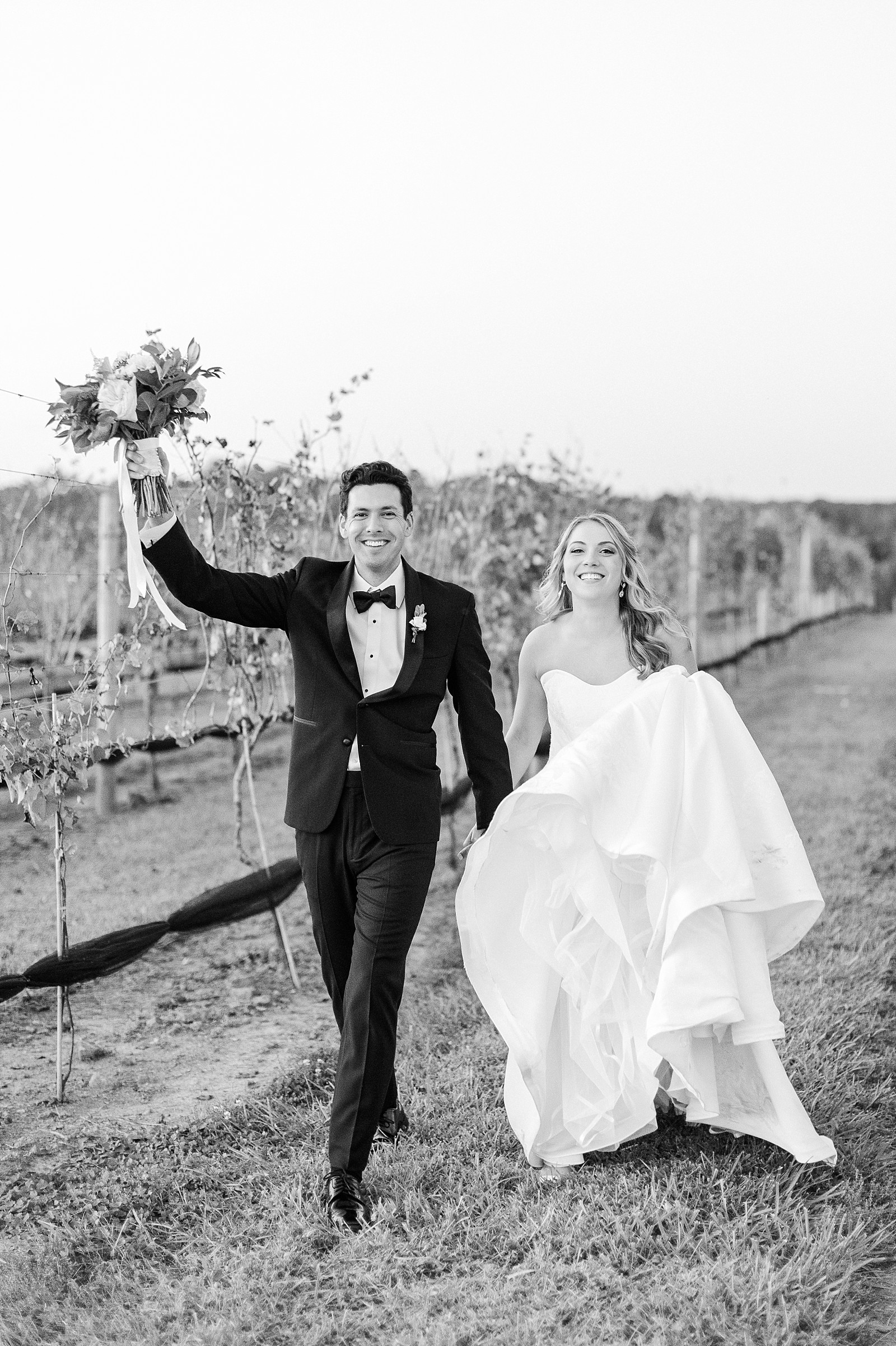 black and white photo of the bride and groom bride and groom dancing in the vineyard | Childress Vineyards Wedding | winery wedding | charlottesville | NC Wedding Photographer 