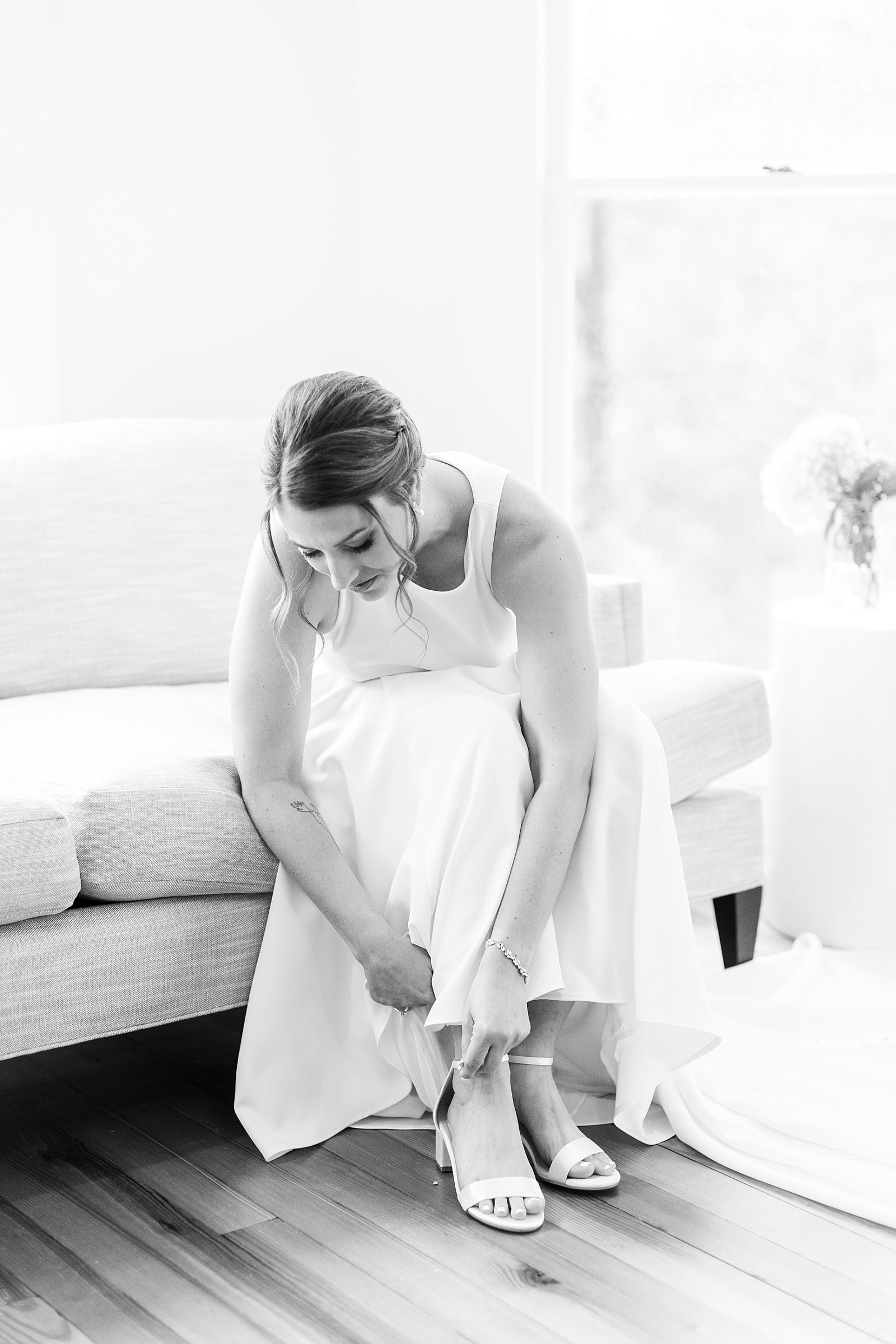 Bride putting on her shoes  | Raleigh NC Wedding Photography