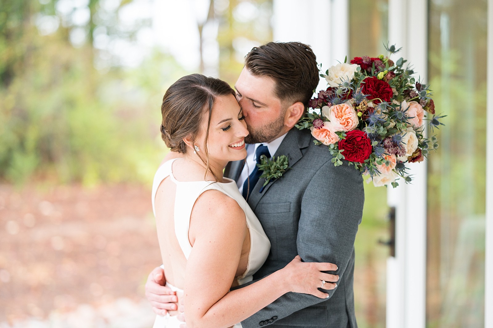 Groom kissing the bride  |The Upchurch in Cary NC | Raleigh NC Wedding Photography