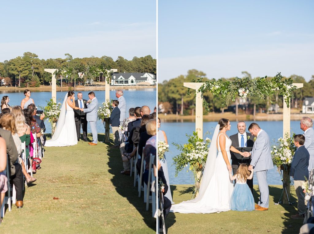bride and groom holding their daughters hand during their ceremony  | Bentwinds Country Club Wedding | Fall Wedding | North Carolina Wedding | Raleigh NC Wedding Photographer 