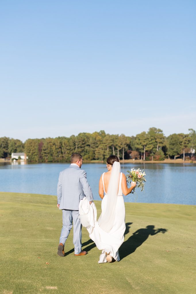 bride and groom walking | Bentwinds Country Club Wedding | Fall Wedding | North Carolina Wedding | Raleigh NC Wedding Photographer | Sarah Hinckley Photography