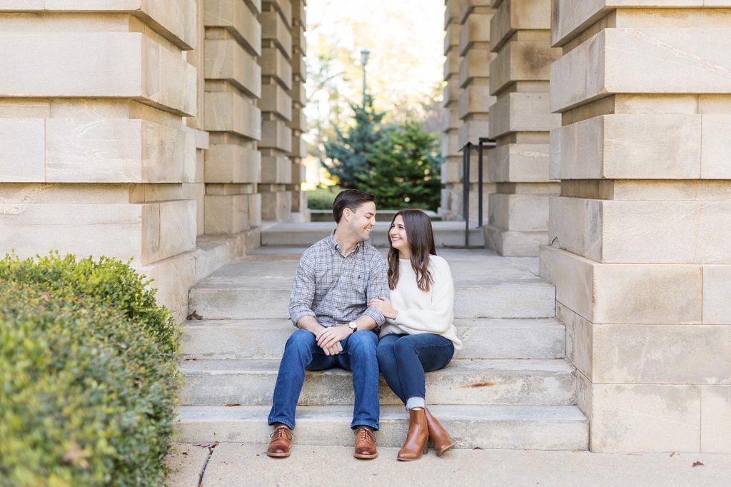 Couple sitting on steps | Downtown Raleigh Engagement Photoshoot | Raleigh NC Wedding & Engagement Photographer | Sarah Hinckley Photography 
