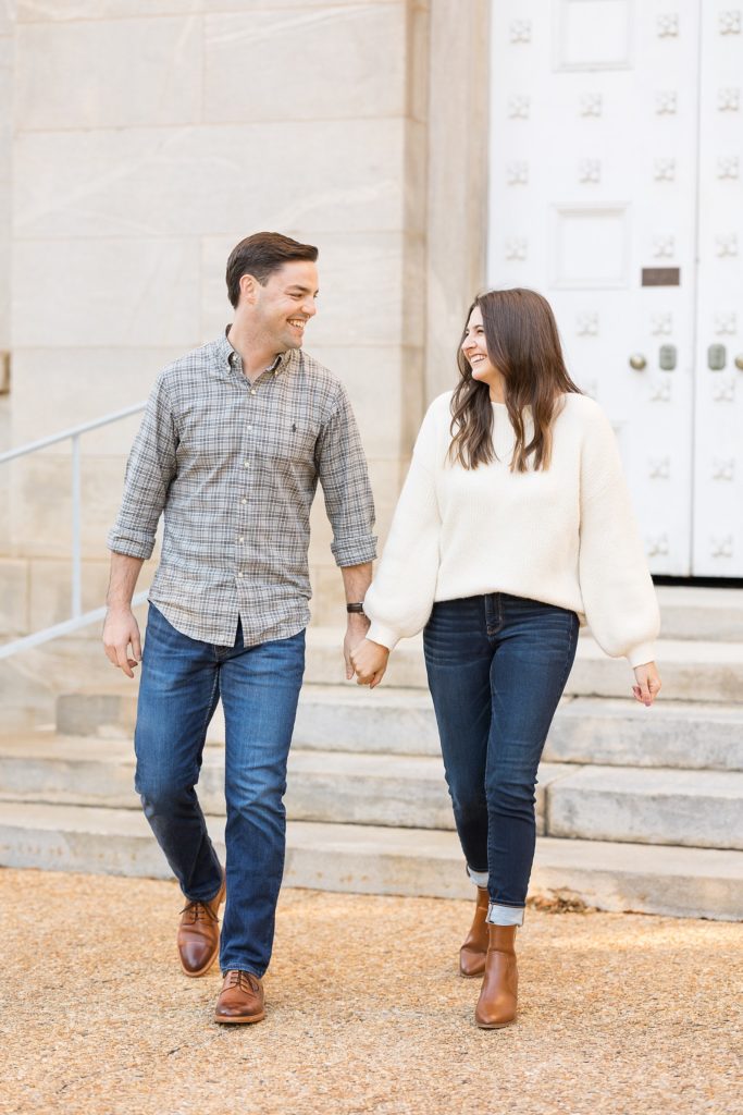 Couple holding hands and walking | Downtown Raleigh Engagement Photoshoot | Raleigh NC Wedding & Engagement Photographer | Sarah Hinckley Photography 
