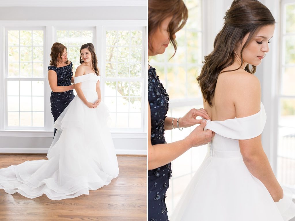 brides mom zipping up brides dress  | Raleigh NC Wedding Photographer